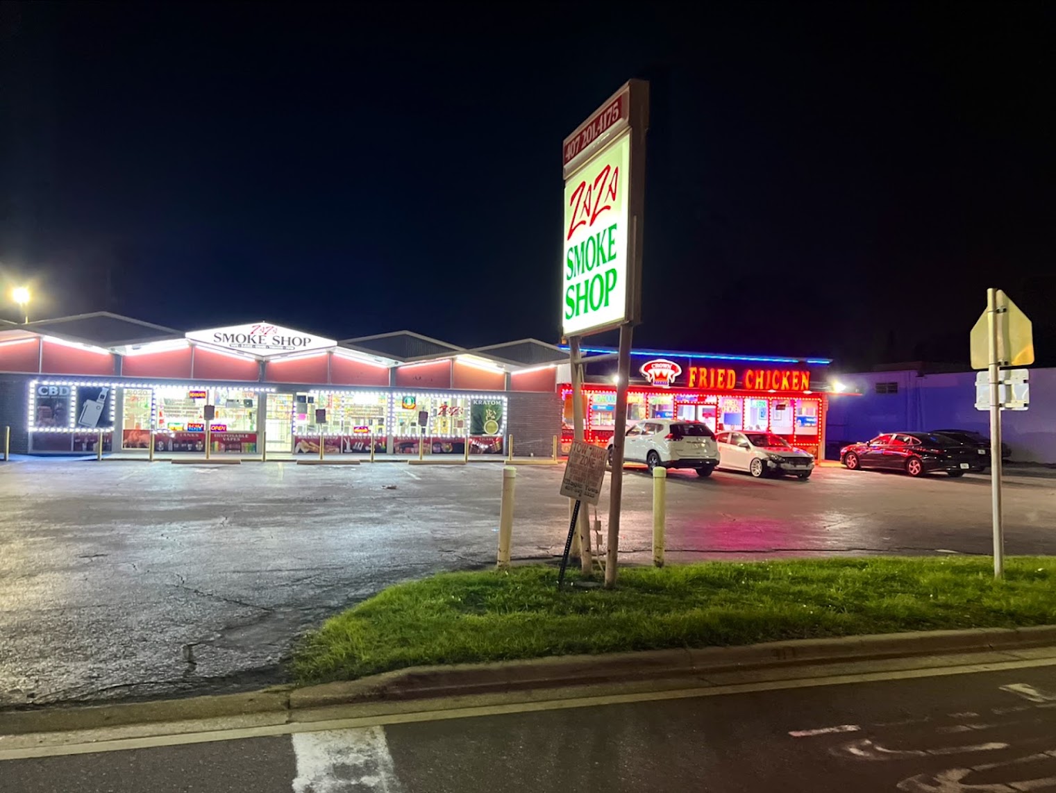 ZAZA Smoke Shop & Vapes — 2020 N Main St, Kissimmee, FL ZAZA Smoke Shop & Vapes exterior and road sign — smoke shop near Disney World at 2020 N Main St, Kissimmee, FL