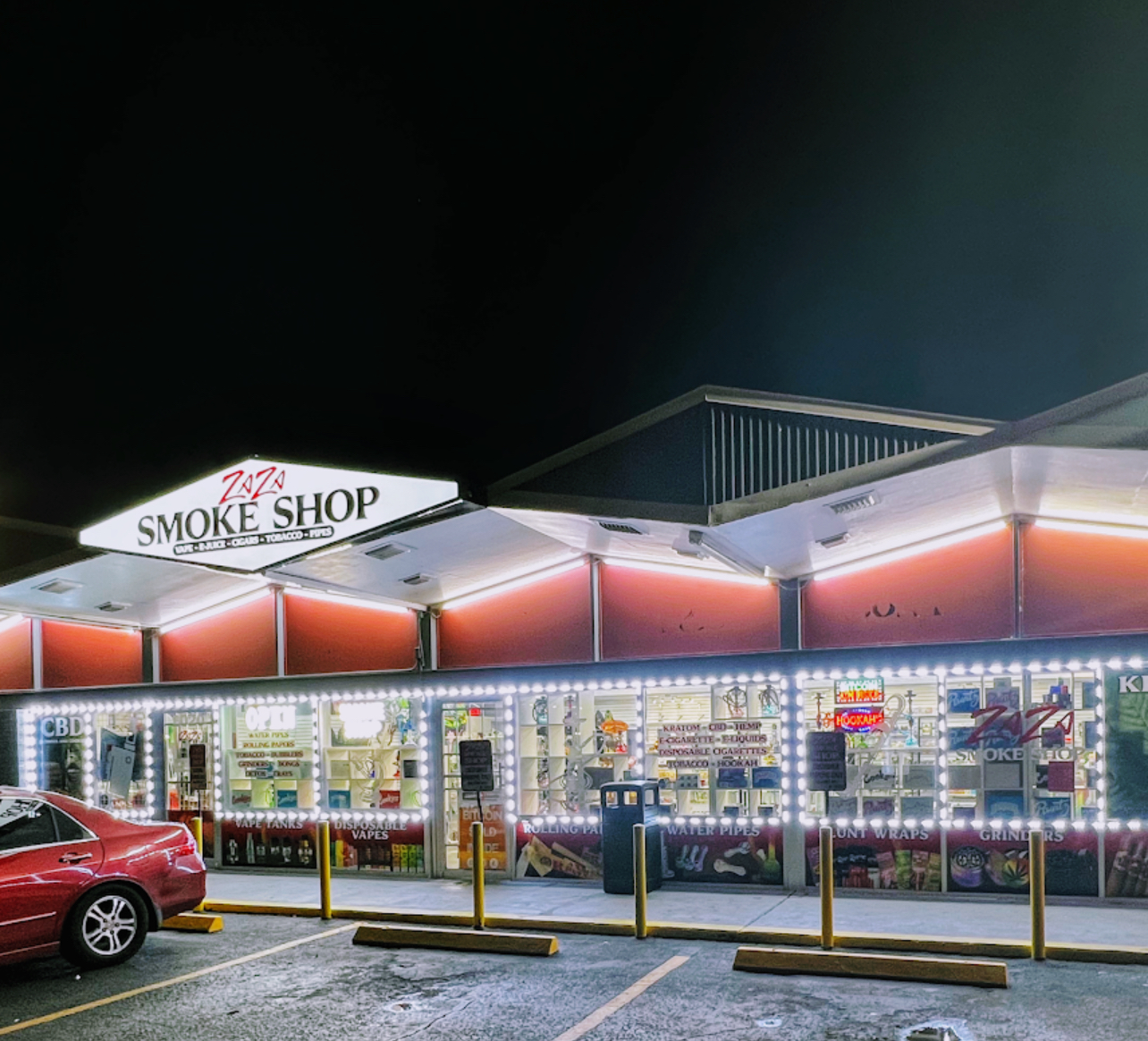 ZAZA Smoke Shop Kissimmee storefront at night — smoke shop open late at 2020 N Main St, Kissimmee, FL